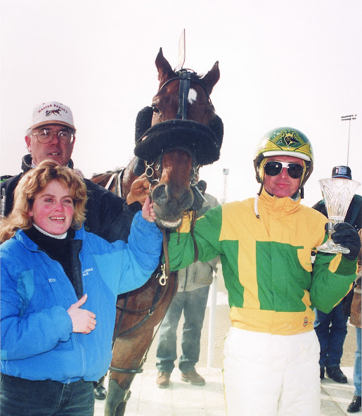 Master Barney and driver Steve Condren appear in the winner’s circle along with owner Bruce Saunders and caretaker Wendy Hoffman.