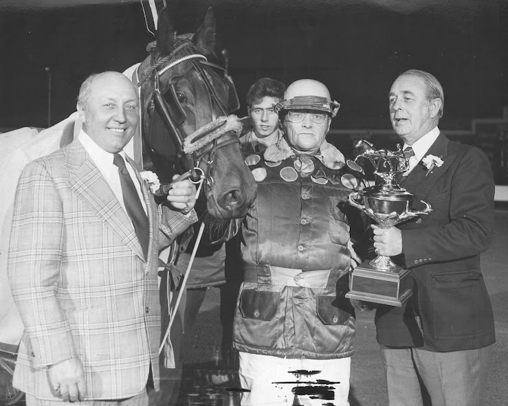 Merrywood Sara and her trainer and driver Don Larkin are seen here accepting a trophy from OHHA officials Fred Goudreau (left) and Tobe Harris (right)