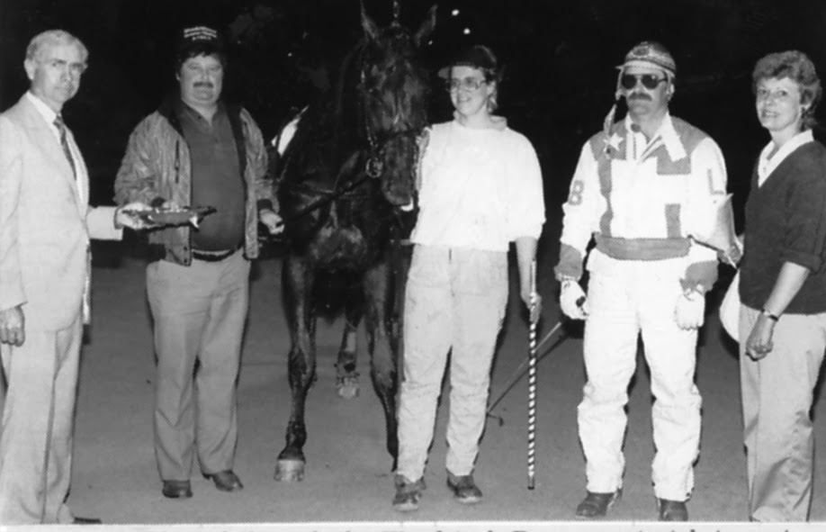 A happy winner’s circle after a victory by K M Lazer and driver Laurie Bako