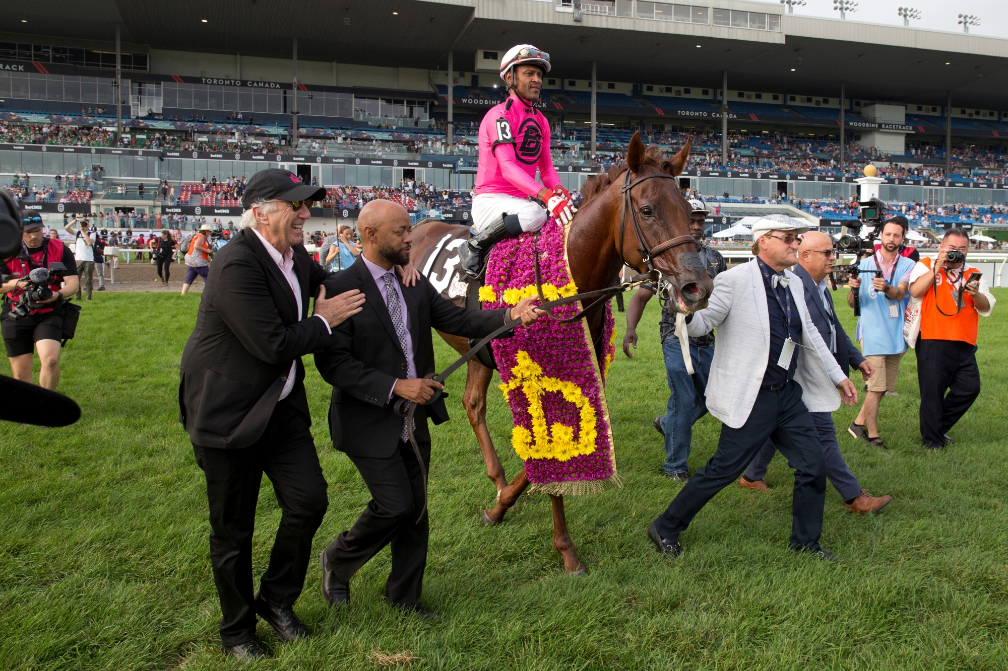 Mike Langlois walking his horse to the winner's circle.